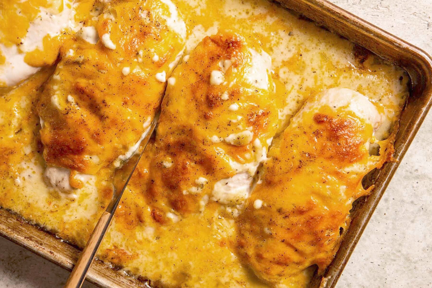 cheesy ranch chicken on a baking sheet after being baked