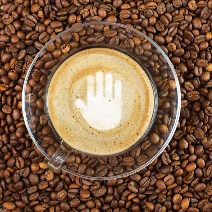 Stop Gesture Sign In Coffee Foam On Coffee Bean Background