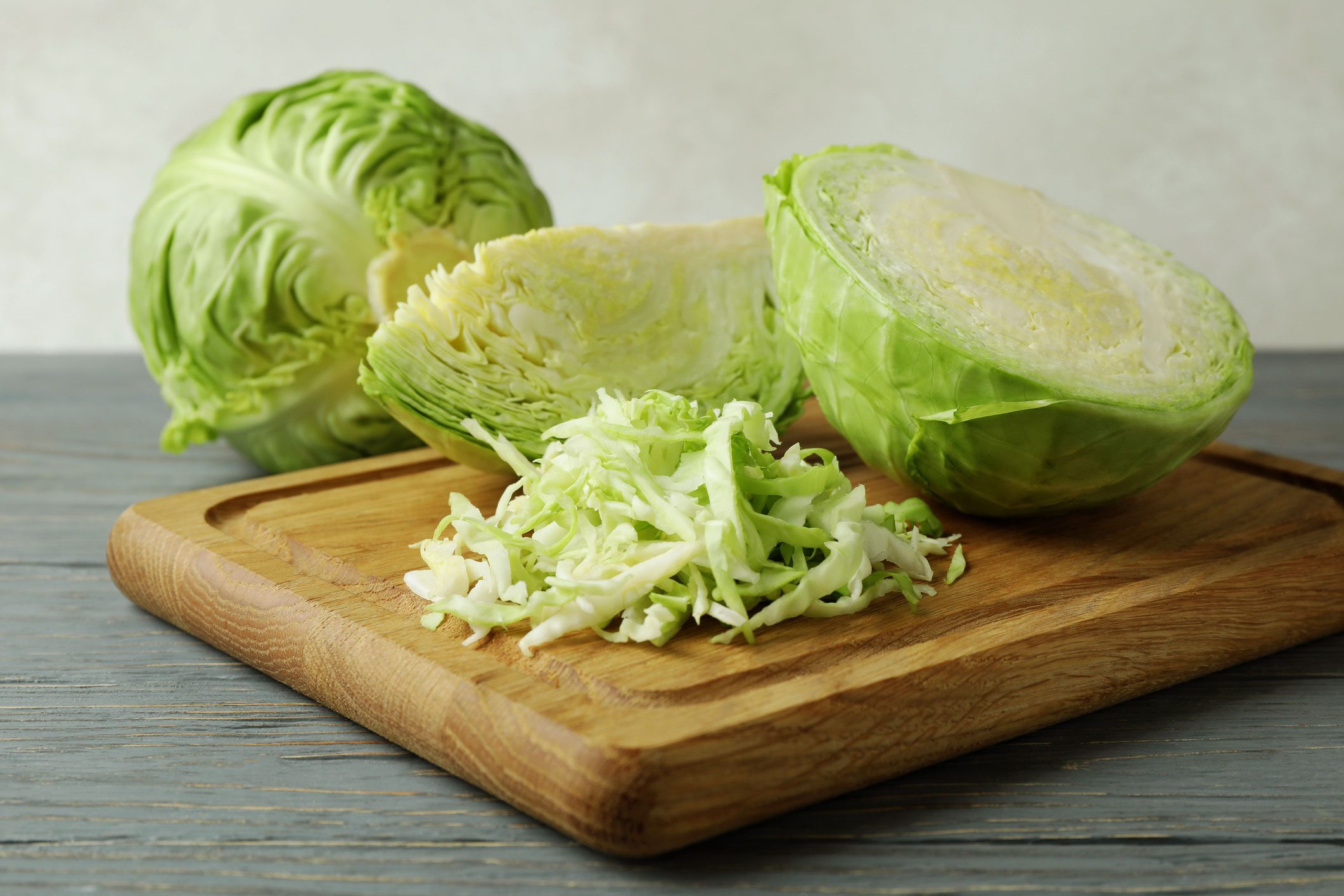 Board With Fresh Green Cabbage On Wooden Background