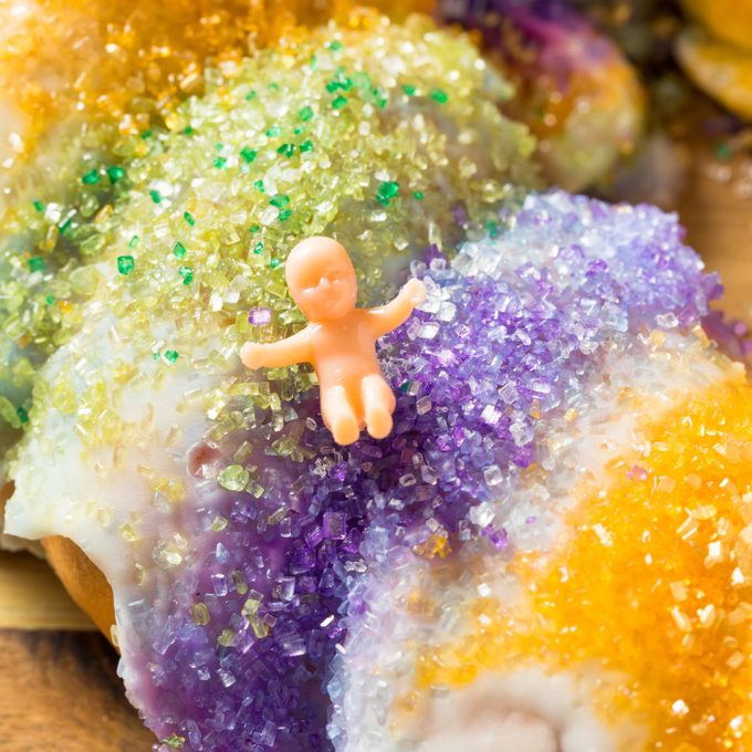 Homemade Colorful Sweet King Cake with a plastic baby on top