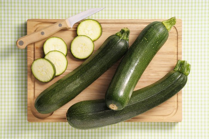 raw zucchini on a cutting board