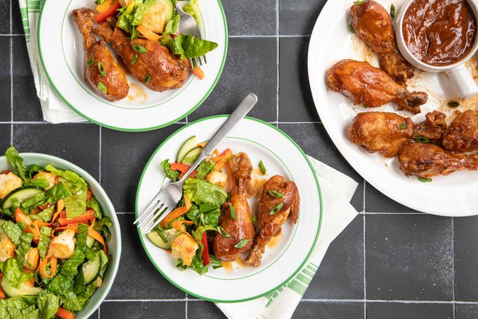 Slow Cooker Chicken Legs served with salad