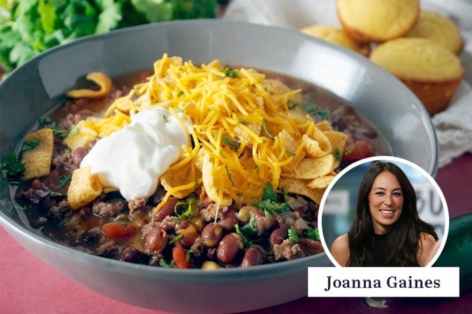 Bowl of chili topped with cheese and sour cream