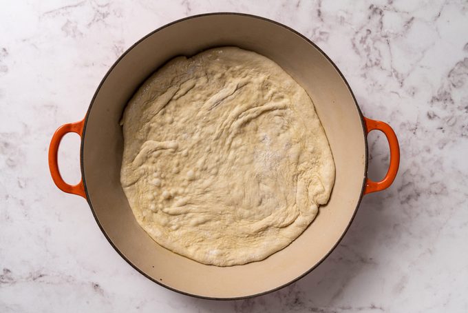 pizza dough in skillet