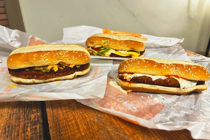 3 New Burger King Chicken Sandwiches on a wooden table