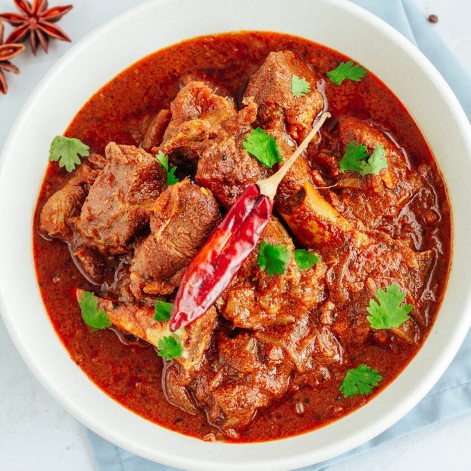 Authentic lamb Vindaloo traditional fiery red Goan curry of lamb.