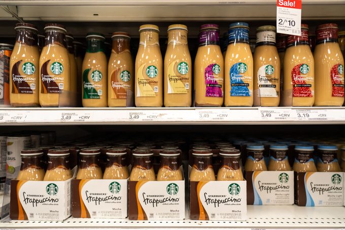 Bottles of Starbucks Frappuccino coffee drinks are seen on a grocery supermarket shelf