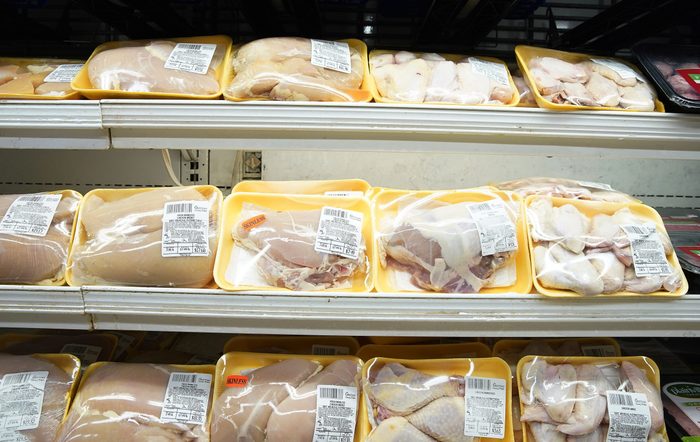 Poultry packages are seen in a supermarket refrigerator in...