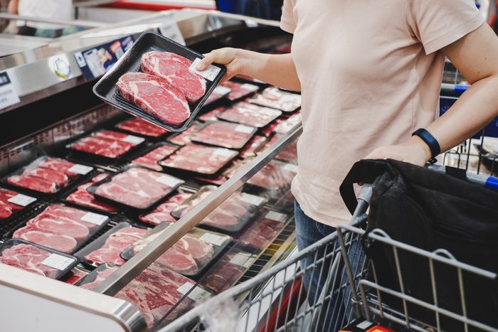 woman shopping at meat section