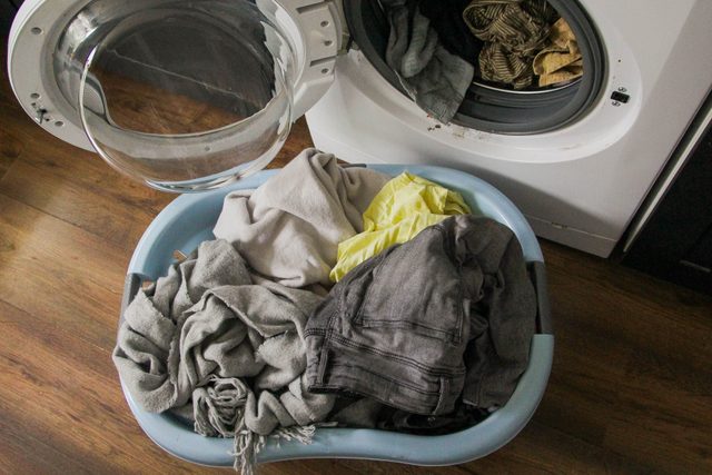 Laundry basket by a washing machine