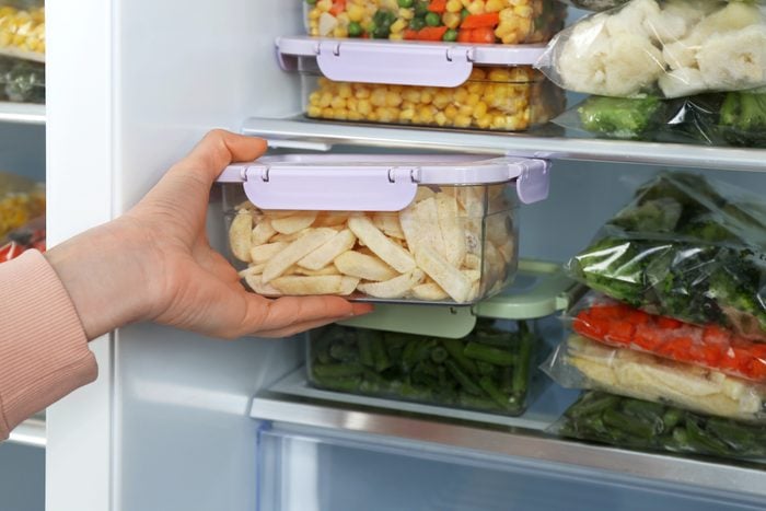 woman organizing her freezer