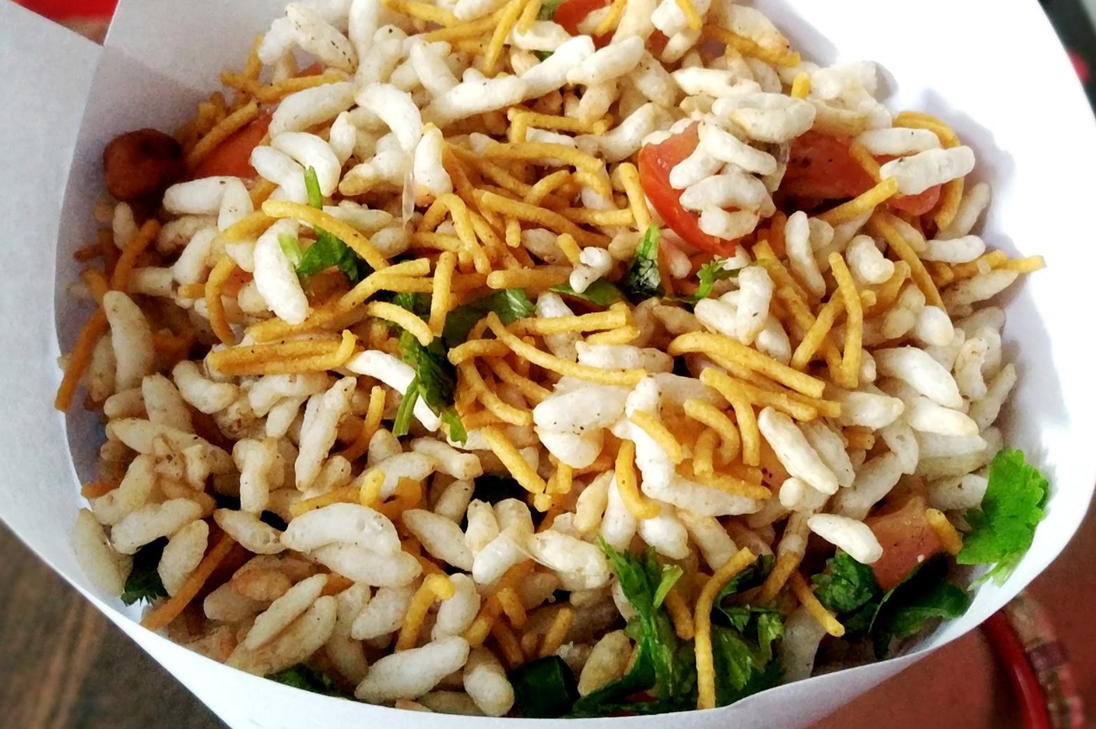 Bhel poori, an Indian road side snack in a conical shape paper container