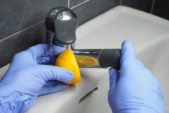 Eco-friendly cleaning in the bathroom with lemon