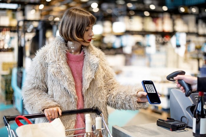 Woman buying with QR code