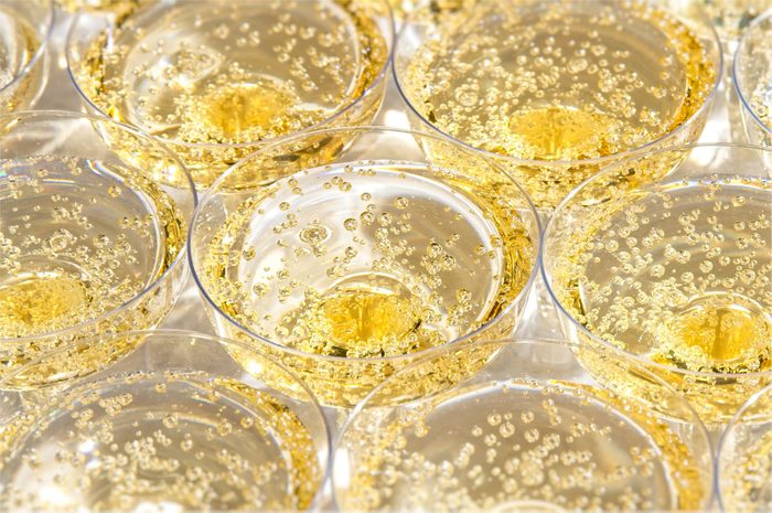 Glasses with bubbling champagne at a wedding