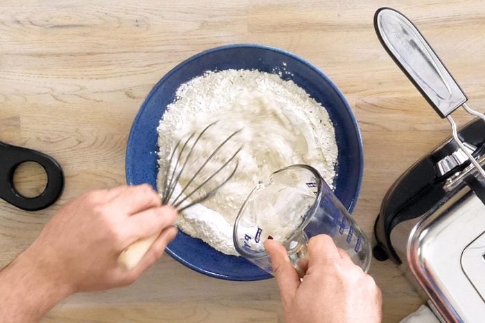 Making fish fry batter in a bowl