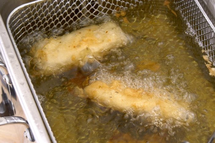 fish fry frying in hot oil