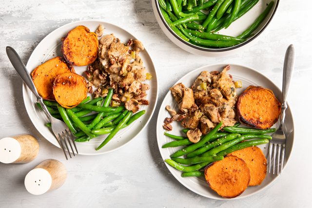 began stuffing on a plate with green beans and sweet potatoes