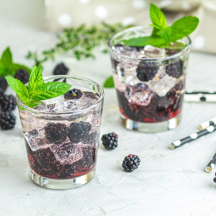 Cold summer berry drink with blackberries