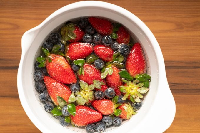 Cleaning strawberries and blueberries