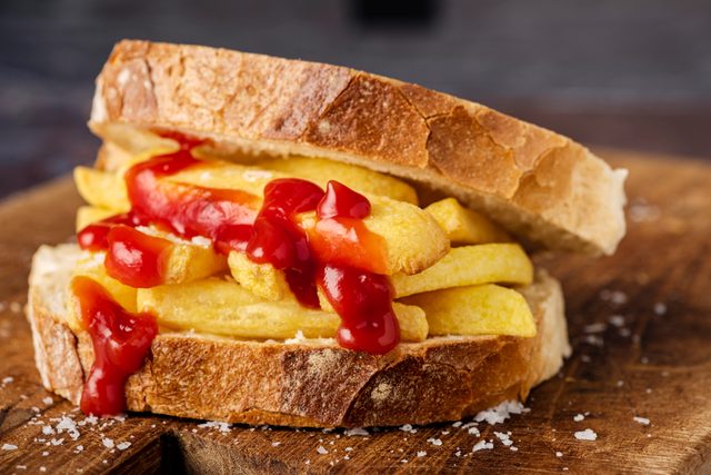 Chip Butty Sandwich with French Fries and Ketchup on bread slices