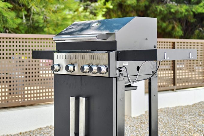 Stainless steel gas grill bbq barbecue in backyard