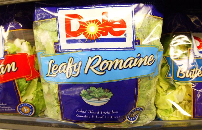 Packaged Salad displayed in a produce section of a supermarket