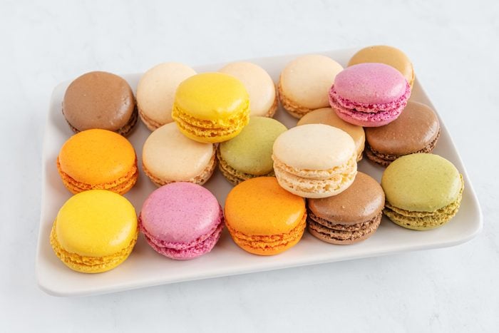 a plate of a variety of macaroons all in different colors