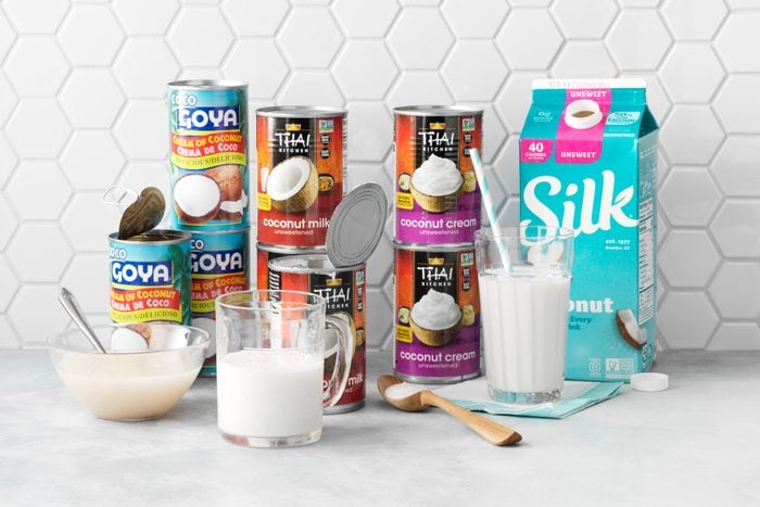various Coconut Cream and Coconut Milk brands on a kitchen counter