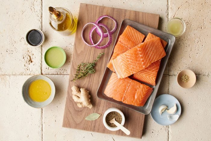 raw salmon and ingredients for making a marinade 