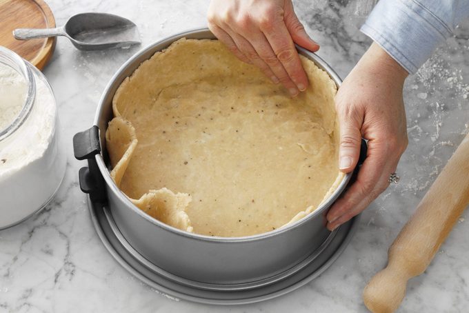 Pizza Rustica Easter Pie dough pressing into pot