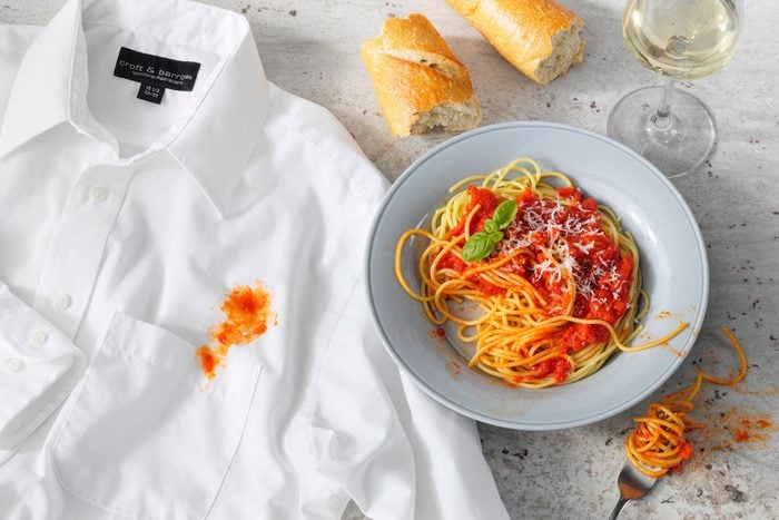 Tomato Sauce Stained Shirt And Spaghetti On Marble Surface