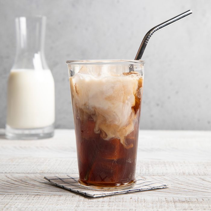 Starbucks shaken espresso in a clear glass with metal straw