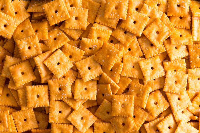 Background texture of square cheese crackers