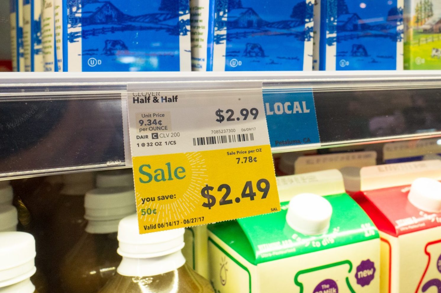 Milk is on display, with a label reading "Sale", at Whole Foods Market grocery store in Dublin, California