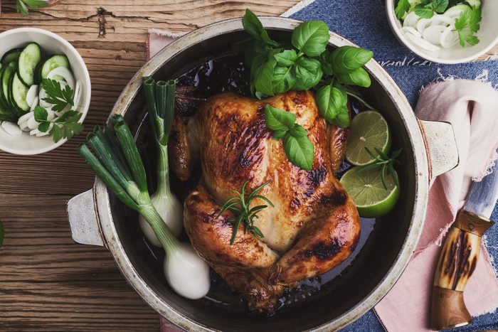 Roasted chicken with green vegetables salad and fresh herbs