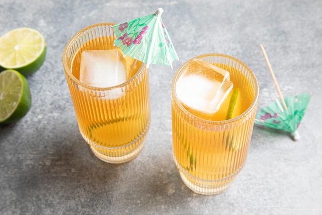 Rum Punch in two glasses with umbrellas