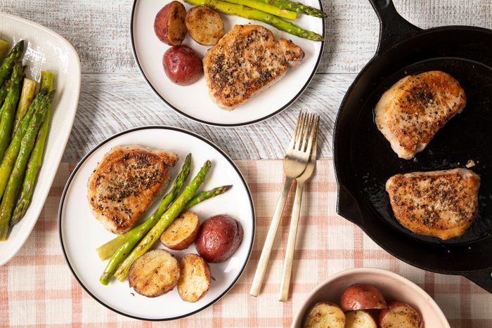 Pan Seared Pork Chops served with roasted potatoes and asparagus