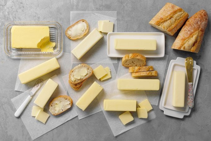 Various butters side by side with slices of bread