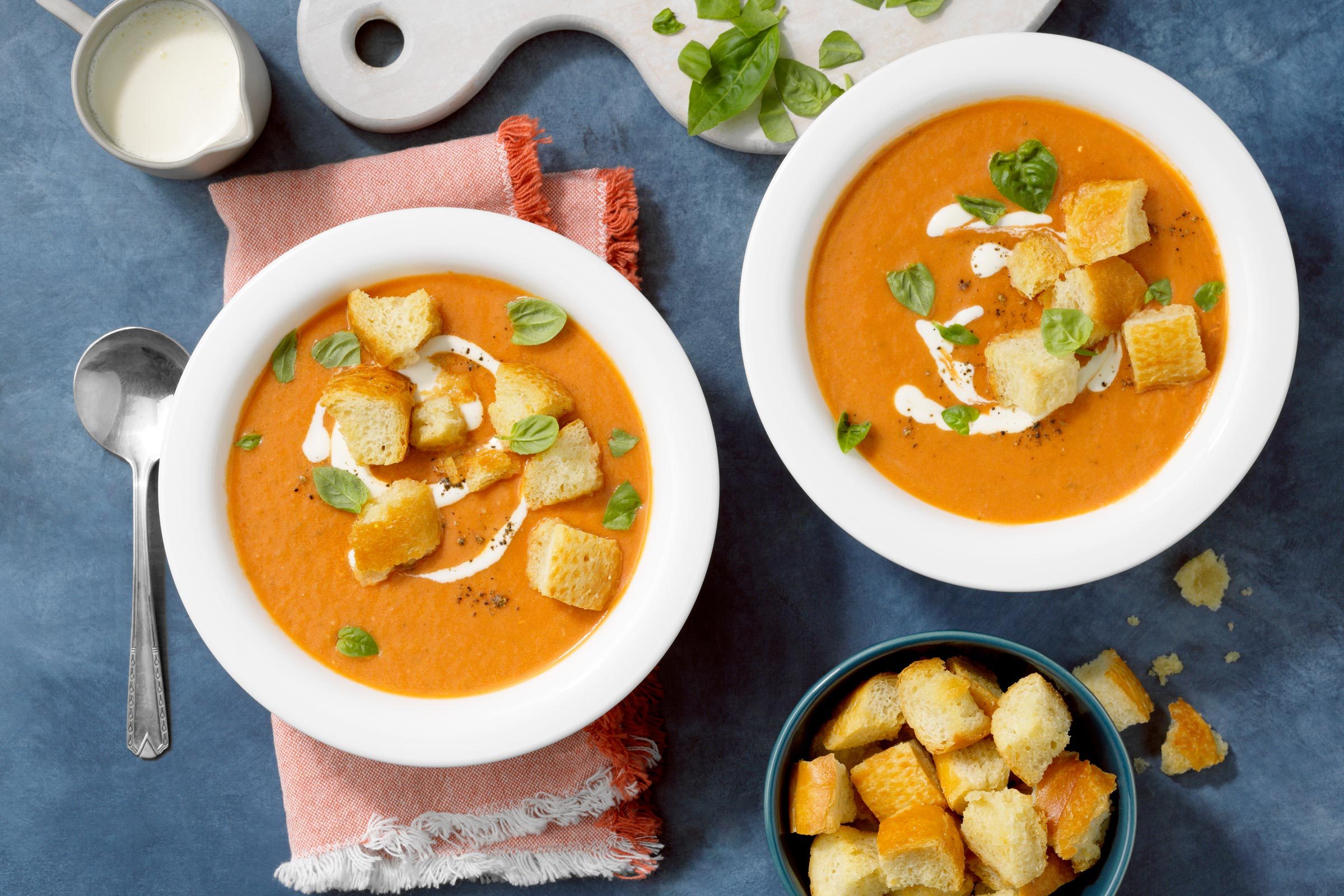 copy cat Panera tomato soup in two bowls topped with croutons
