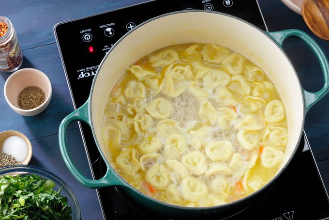 tortellini added into the pot for creamy tortellini soup
