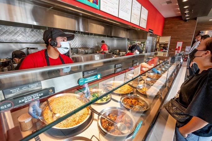 Customer Places order at counter at a Panda Express Restaurant in Garden Grove, CA