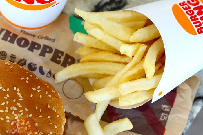 A Burger King Whopper Combo Meal with a Whopper, French Fries and a Coke pictured at a Burger King Restaurant Franchise
