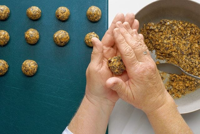 rolling the ingredients into Protein Balls