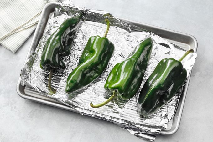 peppers on a foil lined baking sheet