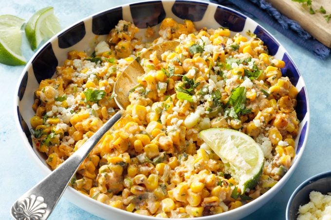 Mexican Street Corn Esquites in bowl with serving spoon