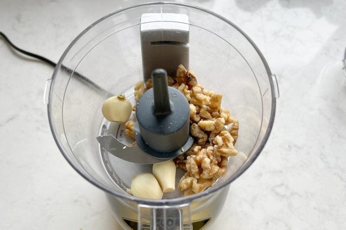 garlic and walnuts in a food processor