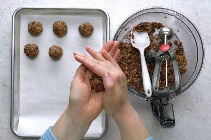 Hands Mixing Ingredients Into Vegan Meatballs