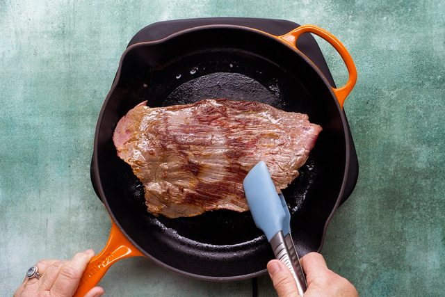 Browning steak In a cast iron skillet