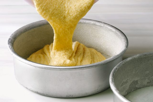 Smash Cake Batter Being Poured into cake pans